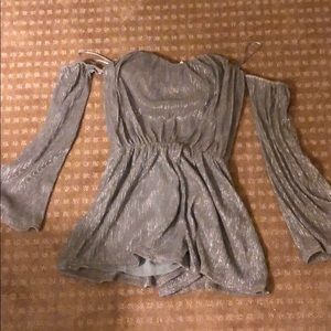 Silver romper with sleeves.